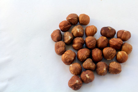 hazelnut in form of heart on the white background