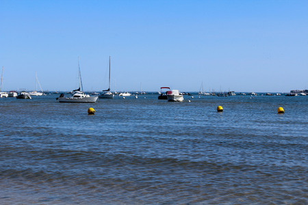 a sand beach with a lot boats on the sea in Franceの写真素材