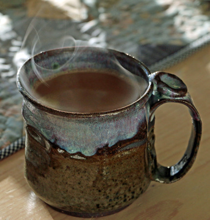 Steaming cup of hot coffeeの写真素材