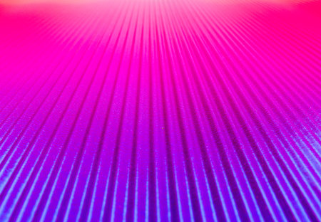 Bright background in blue and red tones, with ribbed texture and focus on the middleの写真素材