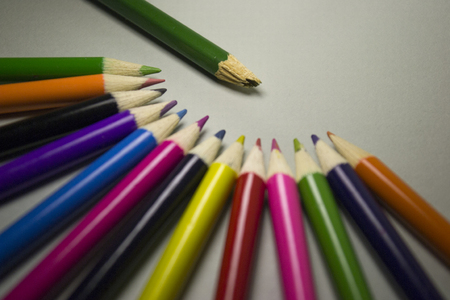 Broken in the center, surrounded by normal pencilsの写真素材