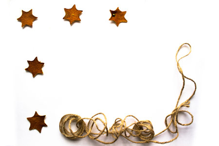Mandarin stars and rope on a white background with a place for your text. Christmas photography.