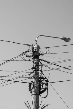 lamp post with wires. industry. city. electric wires. vertical photo