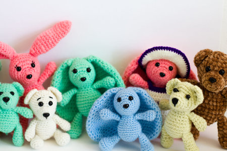 Handmade knitted crochet toys on white background. Selective focus.の写真素材