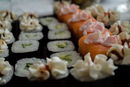 Sushi and rolls on a black background. Close-up.の写真素材
