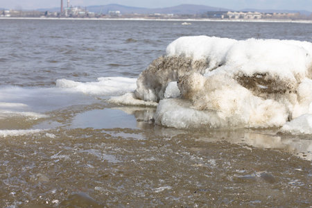 ice and snow on the shore of the river, closeup of photo