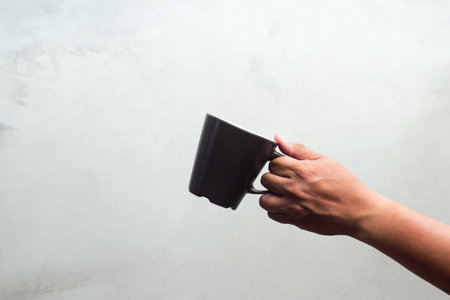 Empty coffee Cup in Handの写真素材