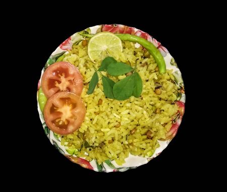 South Indian delicious dish yellow rice in a plateの写真素材