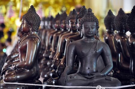 buddha statue on black background.の写真素材