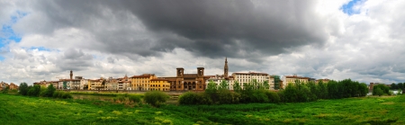 Beautiful panoramic view of Flornce, Arno River, National Library in the middle and with majestic powerful clouds の写真素材