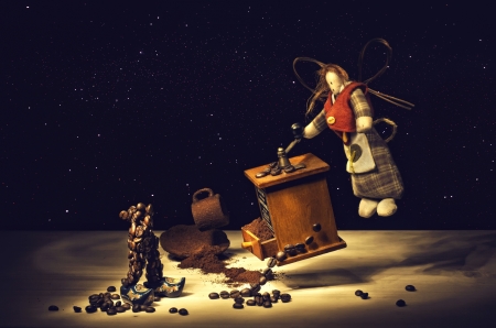 Levitating doll with coffee mill shooting with lighting brush  Stars texture added on background  BW modified to incorrect の写真素材