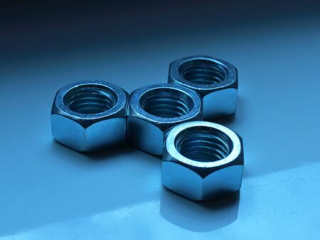 nuts and bolts on the backgroundの写真素材