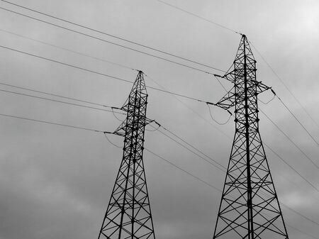power lines wires insulators cloudy dayの写真素材