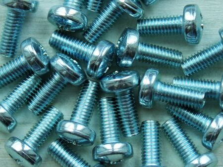 screws and bolts close-up texture backgroundの写真素材