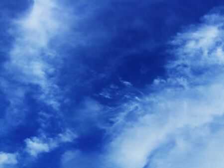 Blue sky with clouds in contrastの写真素材
