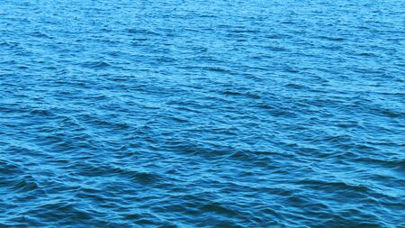 blue waves of the sea contrast without unnecessary objects texture backgroundの写真素材