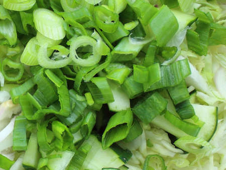 chopped onions, herbs and cucumbers for saladの写真素材