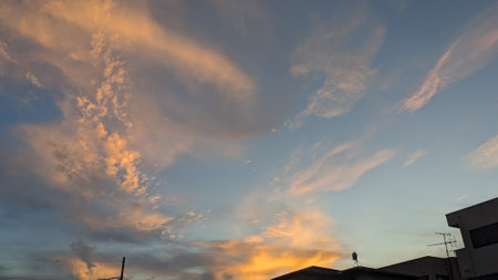Beautiful orange sunset sky and cloudsの写真素材