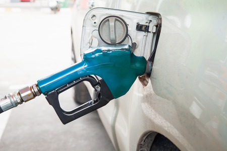 fuel nozzle in pouring to car.の写真素材