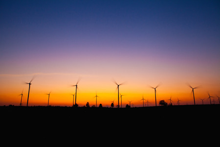 Windmill silhouette on suset backgroundの写真素材