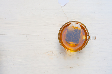 Top view Cup of tea on a white tableの写真素材