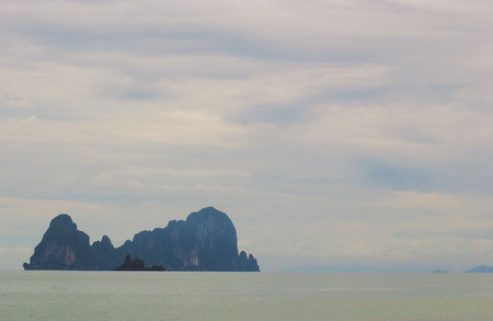 cloudy sky with isolated islandの写真素材