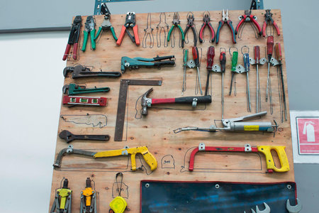 set of tools in tool box on a wooden background