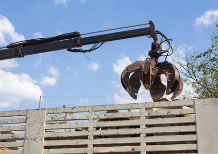 garbage truck with manual hydraulic. Claws of mechanical moving arm