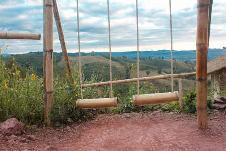 Dual bamboo swing on the mountain.の写真素材