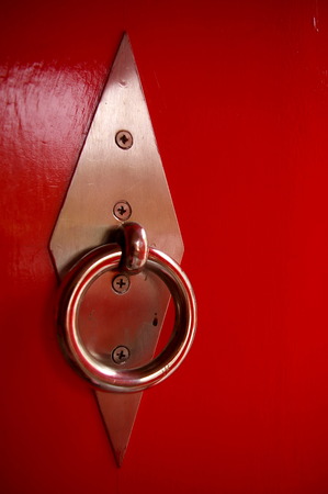 door knocker on wooden gateの写真素材