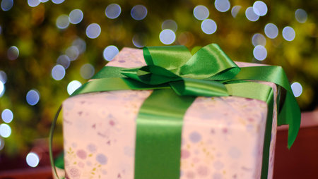 Christmas gift box decorations against lights backgroundの写真素材