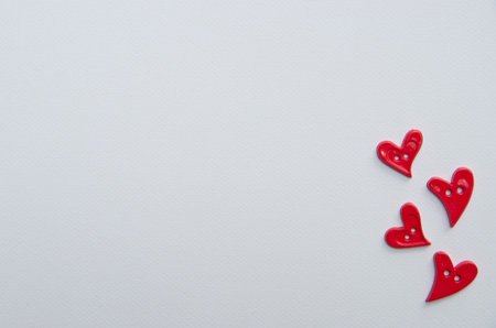 Heart shape studs arranged on drawing paperの写真素材