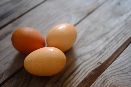 three egg on the wooden tableの写真素材