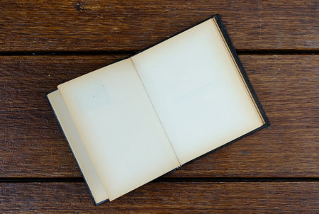 open blank old notebook on wooden tableの写真素材