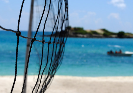 Beach volleyball net beside the seaの写真素材