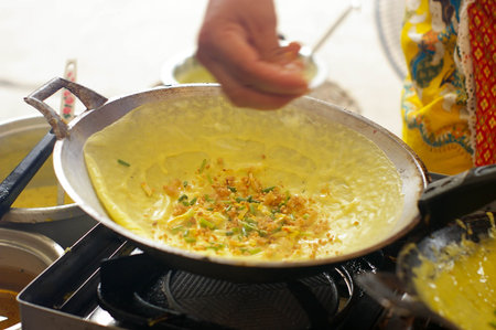Hand try to made Vietnamese stuffed crispy omelette, Thai desertの写真素材
