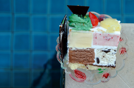 sweety ice-cream cake beside the blue poolの写真素材