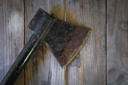 close-up old ax on a wooden tableの写真素材