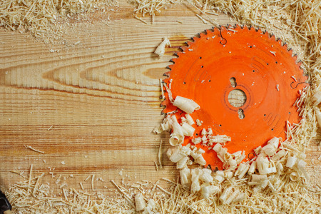 circular saw among the sawdust on a wooden bench. place for your advertisingの写真素材