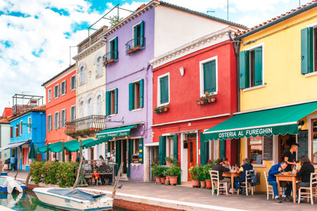 Burano, Venice, Italy - October 10, 2017: Street cafe and tourists on Burano island, Venice, Italy Burano city lifestyleのeditorial素材