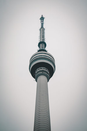 Iconic Guishan Television Tower in Wuhan, China captured on cloudy day with simple sky backdrop.