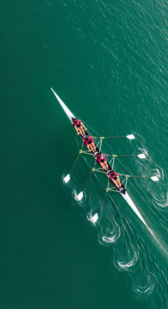 Aerial view of two men rowing in a row on the waterの素材