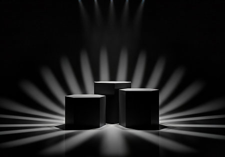 Three black hexagonal stands are dramatically lit by spotlights in a dark studio, creating a sense of importance and highlighting the product placement.の素材