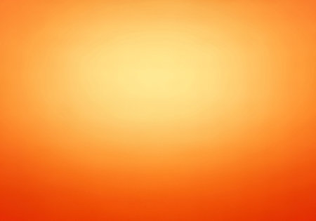 A smooth, vibrant radial gradient background transitioning from a bright yellow-orange center to a rich, warm orange-red at the edges, creating an energetic glow.の素材