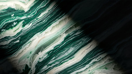 A stunning abstract image showcasing a close-up view of a stone texture. The composition features layers of emerald green and white, with dramatic lighting creating shadows and highlights. The texture evokes a sense of depth and natural beauty.の素材
