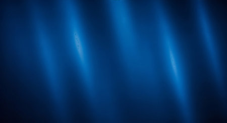 Abstract image of blue light beams shining on a dark background with a white space belowの素材