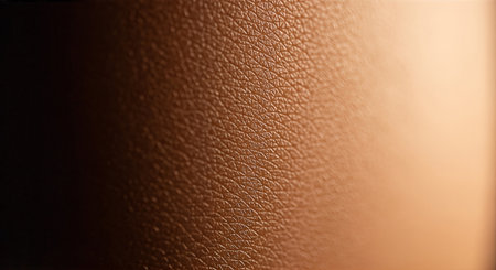 Detailed close-up of a brown leather surface with a rough textureの素材