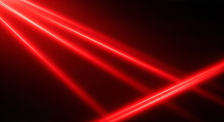 Bright red laser lines crossing in dark spaceの素材