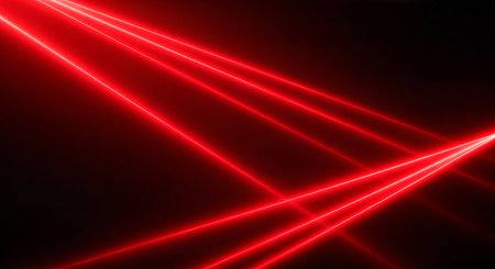 Bright red laser beams intersecting on a dark backgroundの素材