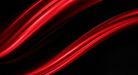 Abstract image of red light trails on a black backgroundの素材
